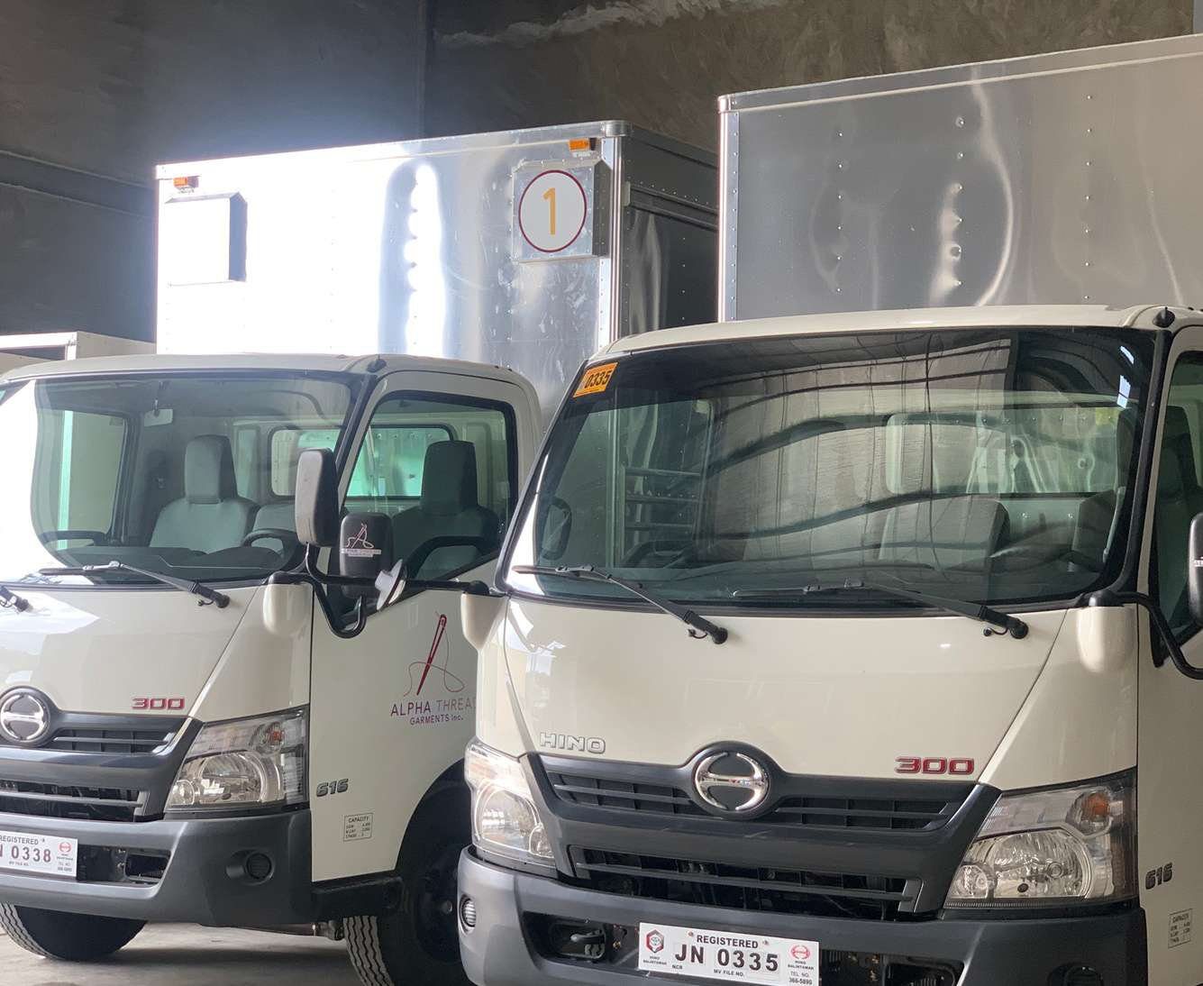 Alpha Thread delivery trucks ready for dispatch
